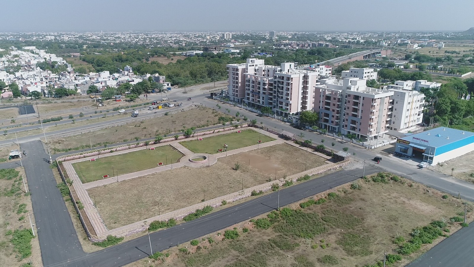 Wide aerial of Shanti Tower and surroundings